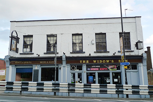 The Widow's Son pub in Bromley-by-Bow is famous for its collection of hot cross buns above the bar. But why are they hanging there? Click to find out.