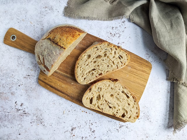 An image of slices of handcut bread on a board.