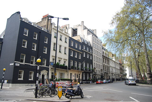 A row of Georgian townhouses in a London square - Berkeley Square, to be exact.
